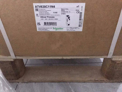 Schneider Electric ATV630C11N4 Inverter, packaged for shipping, product label visible.