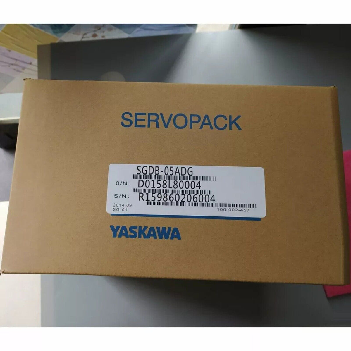 YASKAWA SGDB-05ADG Servopack in brown box. Industrial automation servo drive product.