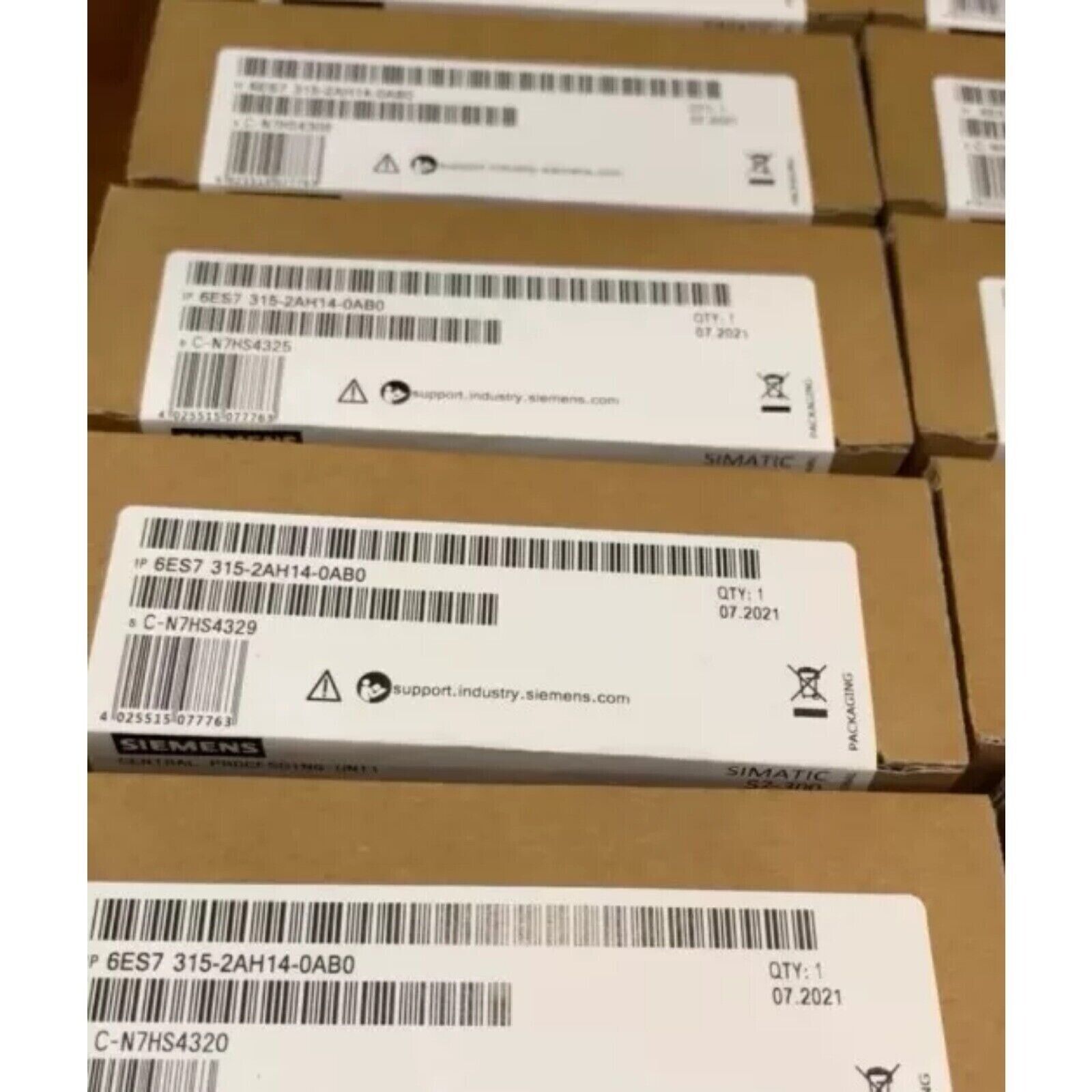 Siemens SIMATIC S7-300 CPU 6ES7315-2AH14-0AB0 boxes, industrial automation parts, packaging.