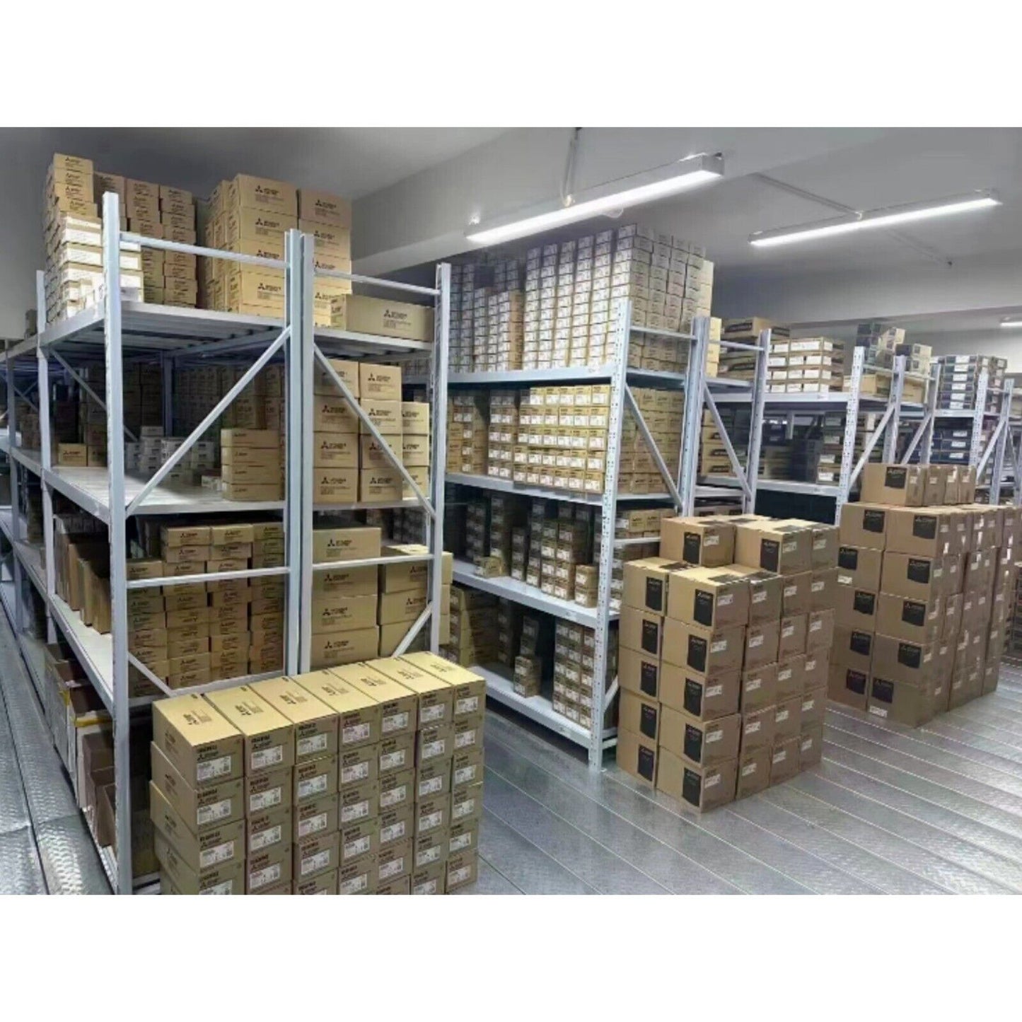 Industrial Automation Parts Warehouse: Shelves of Siemens and other brand boxes, equipment storage.