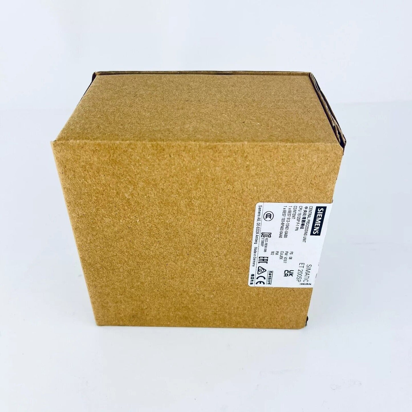 Siemens SIMATIC ET 200SP CPU 1512SP F-1 PN in original packaging. PLC module product label visible.