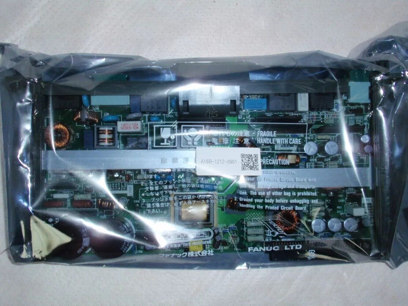 FANUC A16B-1212-0901 new board, PLC module in protective packaging. Handle with care.