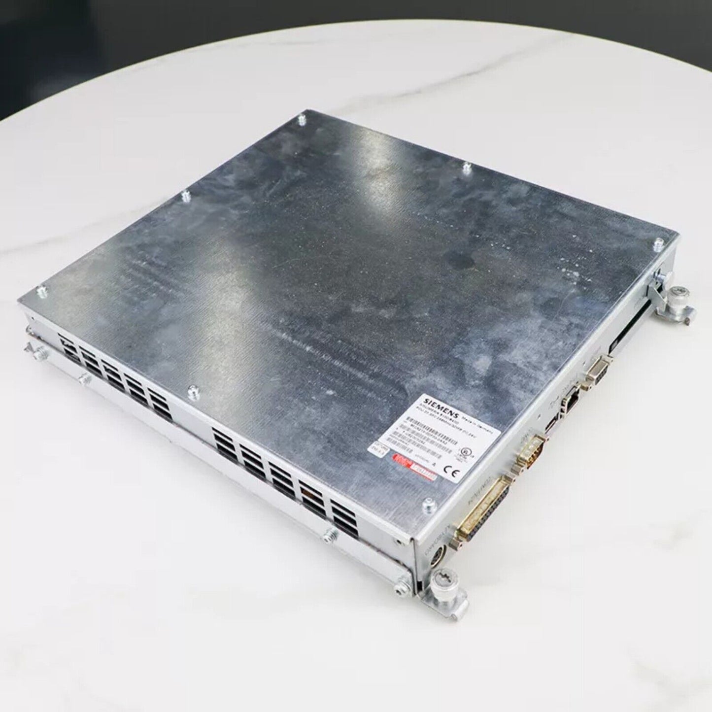 Siemens 6FC5210-0DF00-0AA2 PLC Control Unit, metal casing with ports, industrial automation part.