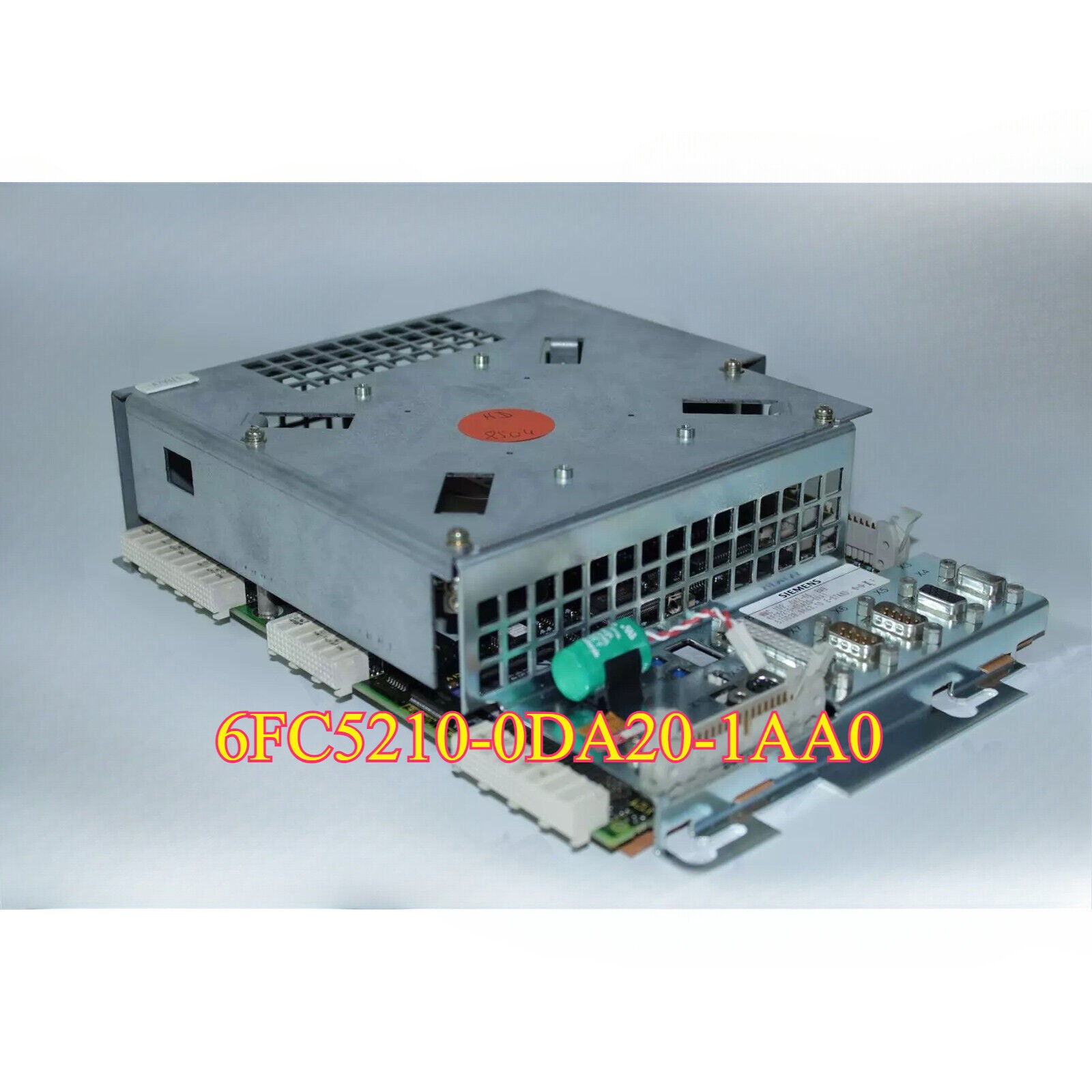 Siemens PLC module 6FC5210-0DA20-1AA0, a gray and silver electronic component with the model number clearly visible.