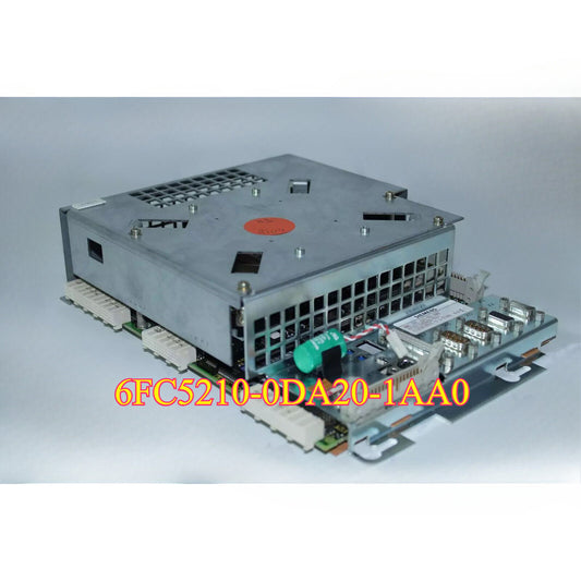 Siemens PLC module 6FC5210-0DA20-1AA0, a gray and silver electronic component with the model number clearly visible.