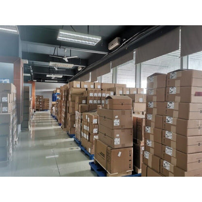 Warehouse stock of industrial automation parts, including PLC modules and VFDs, ready for shipping. Radwell International.