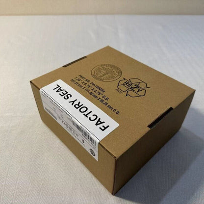 Allen-Bradley 1769-L33ERM CompactLogix controller box with factory seal. Brown cardboard packaging.