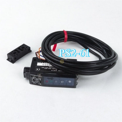 Keyence PS2-61 photoelectric sensor with cable and mounting bracket. Industrial automation sensor.
