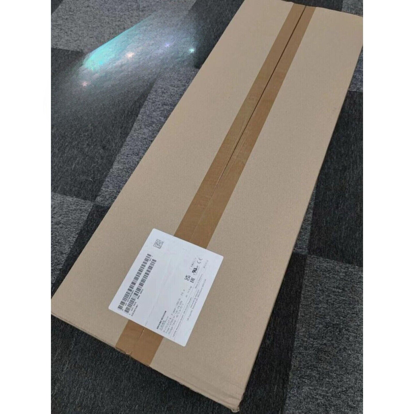 Siemens PLC module JJY:023424020001 packaged in a cardboard box, industrial automation component.