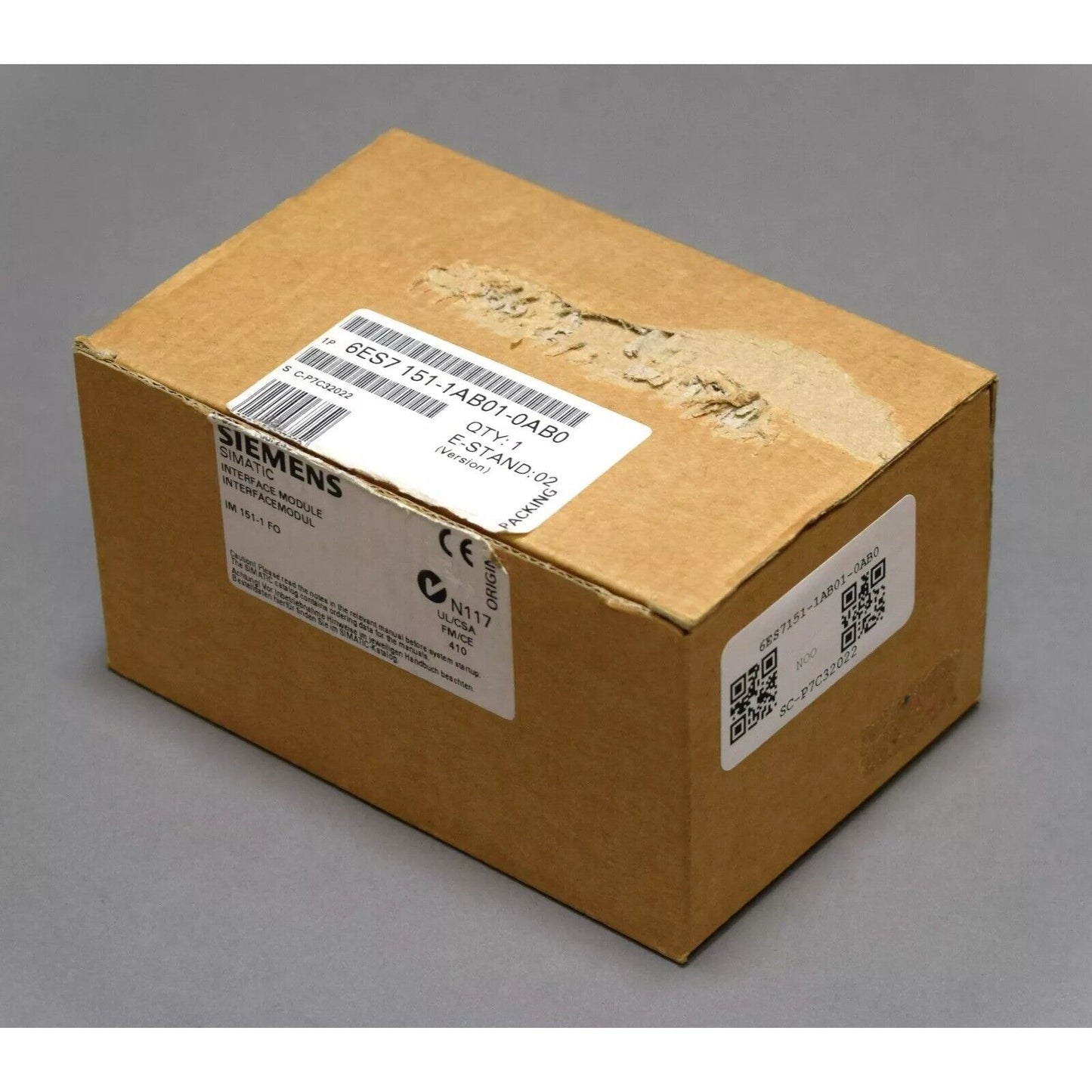 Siemens SIMATIC IM 151-1 FO DP Interface Module in a brown cardboard box.