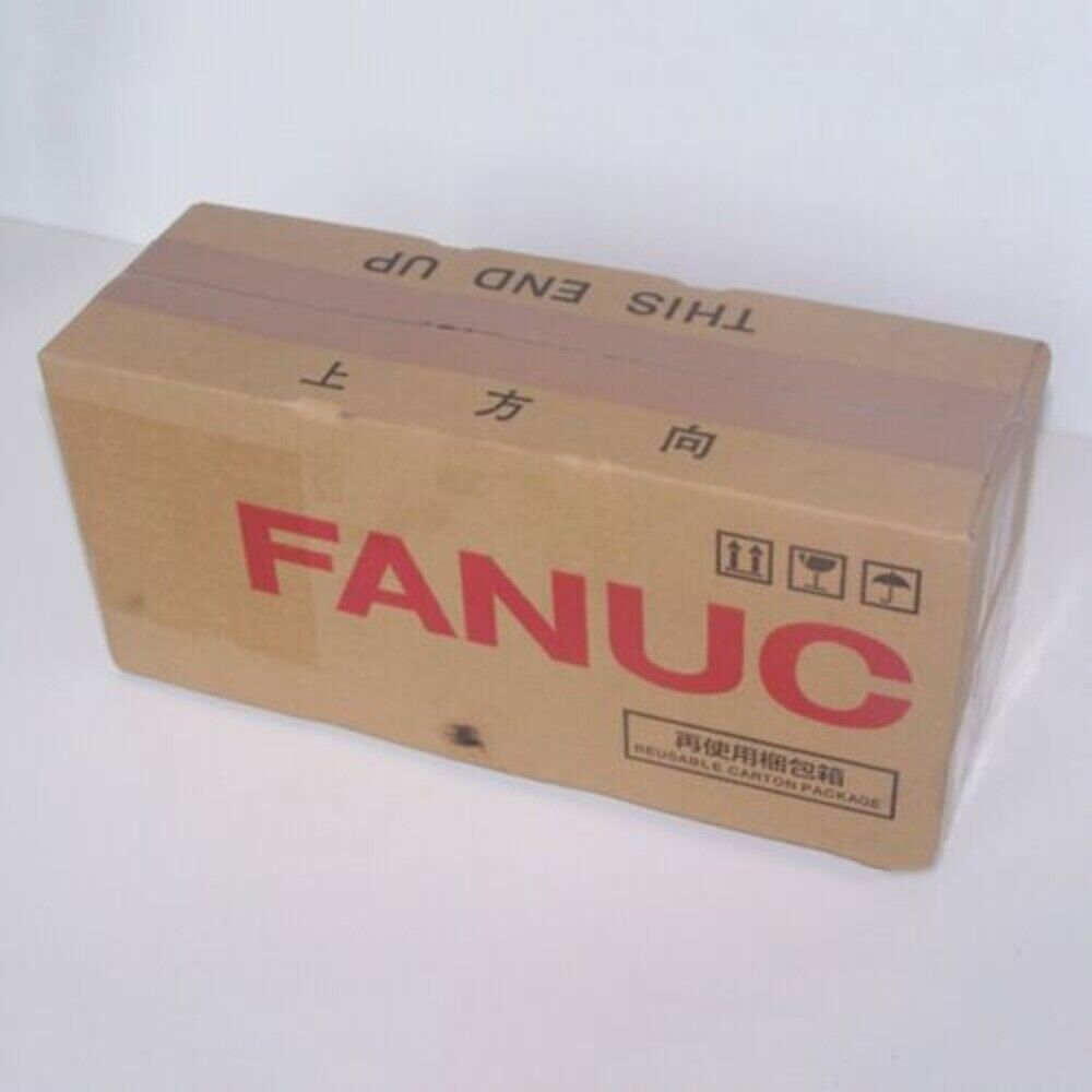FANUC servo motor packaging, brown cardboard box, 'THIS END UP' label
