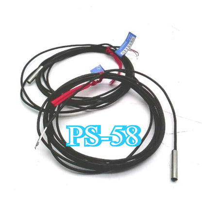 Keyence PS-58 Sensor. Industrial automation sensor with black cable.