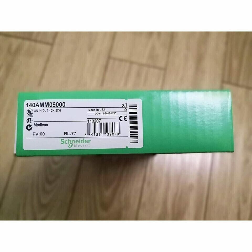 Schneider Electric 140AMM09000 PLC Module box, green with product information label.