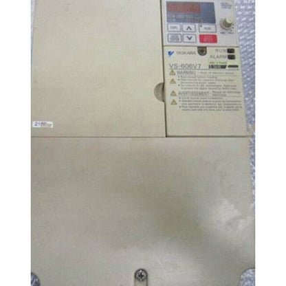 YASKAWA VS-606V7 Inverter, Beige Control Panel with Warning Labels and Display, Industrial Automation Equipment