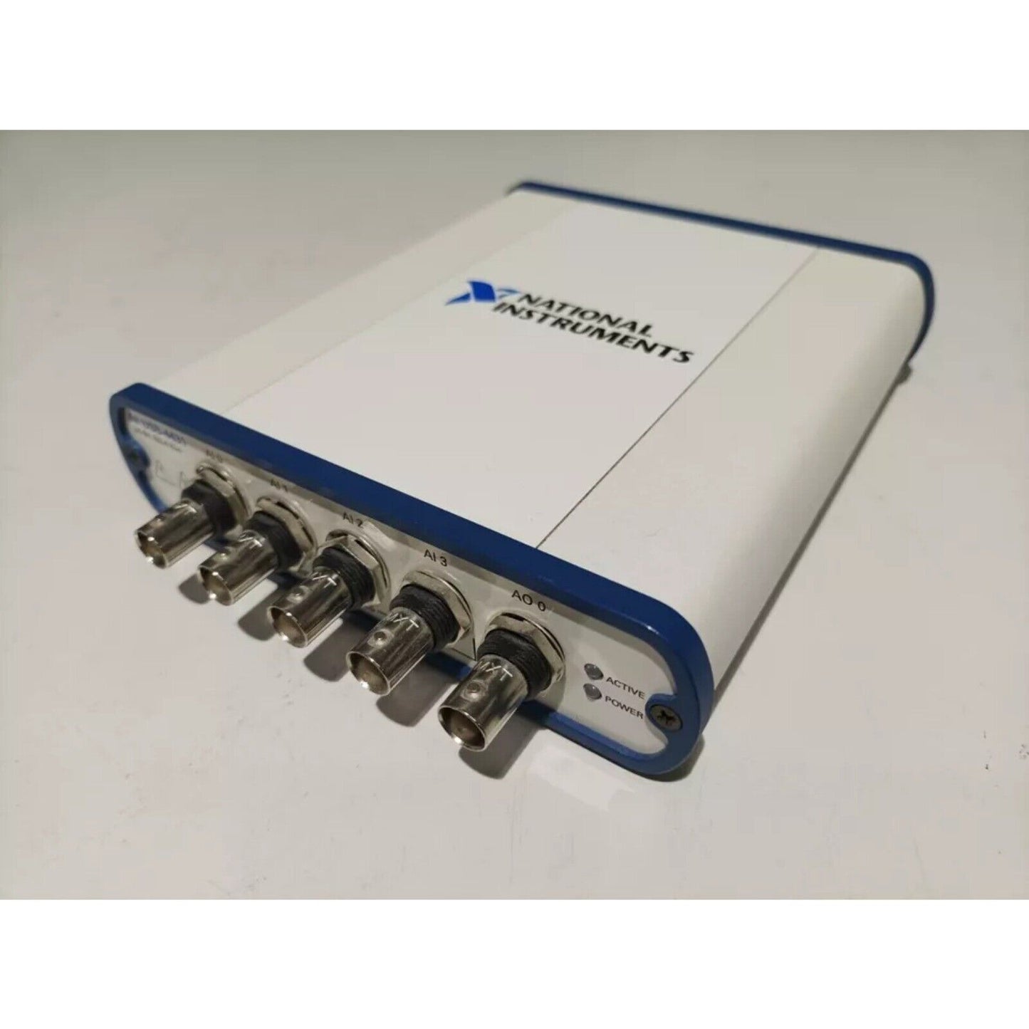 National Instruments USB-4431 data acquisition device, white and blue, BNC connectors for sound and vibration.