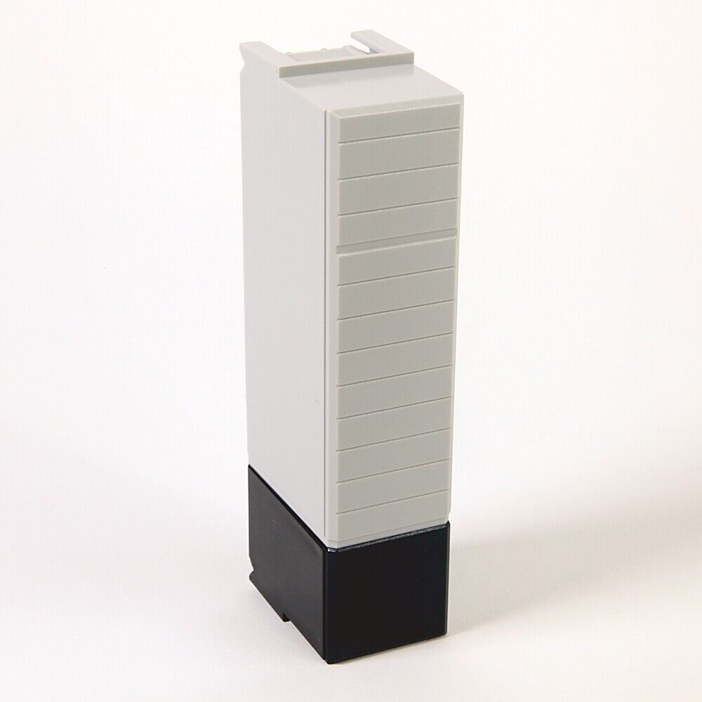 Allen-Bradley 1756-N2 Slot Filler PLC Module. Grey and black plastic module on white background