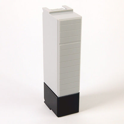 Allen-Bradley 1756-N2 Slot Filler PLC Module. Grey and black plastic module on white background