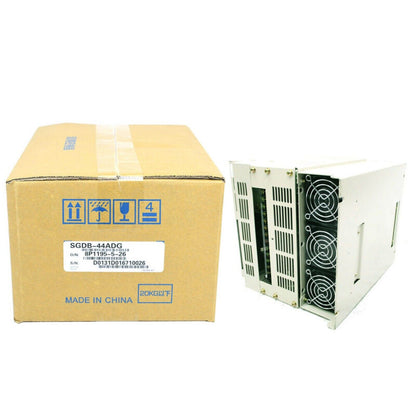 YASKAWA SGDB-44ADG servo drive, new in box, featuring a beige cardboard box and white servo drive module, Made in China.