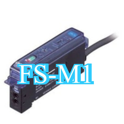 Keyence FS-M1 Fiber Amplifier Sensor. Black and dark blue sensor with FS-M1 printed on it, connected to a cable.