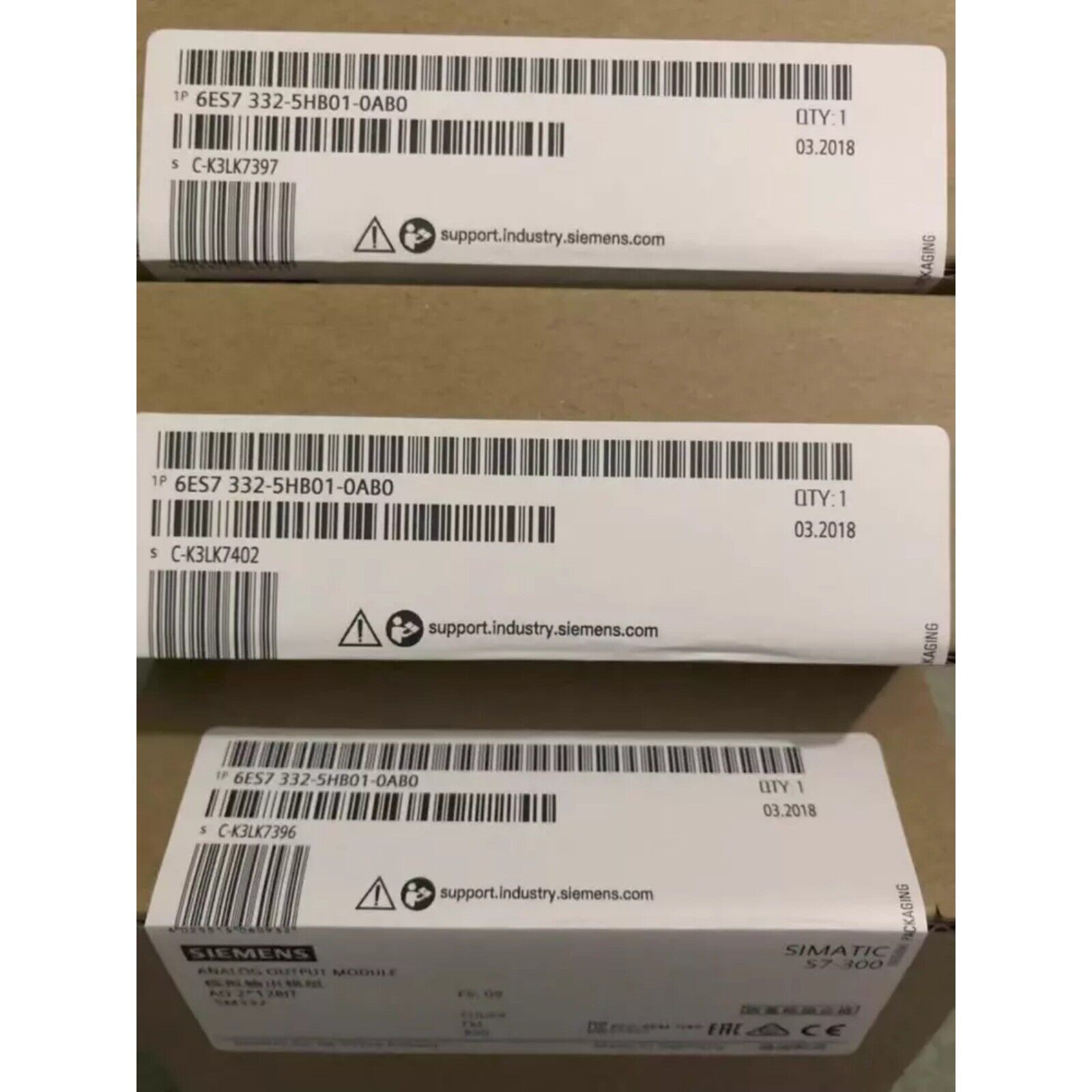 Siemens SIMATIC S7-300 analog output module boxes. Includes the product code 6ES7332-5HB01-0AB0.
