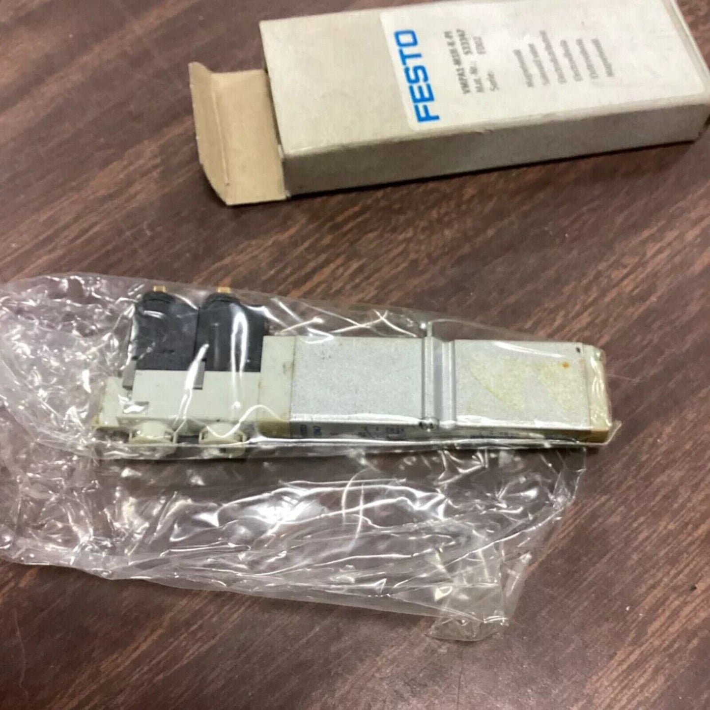 Festo VMPA1-M1H-K-PI air solenoid valve in packaging, industrial automation component