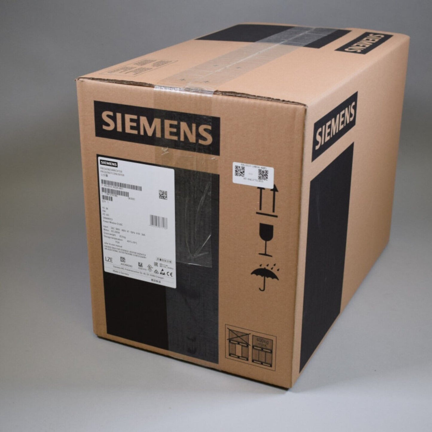 Siemens PLC component in a cardboard box, industrial automation part