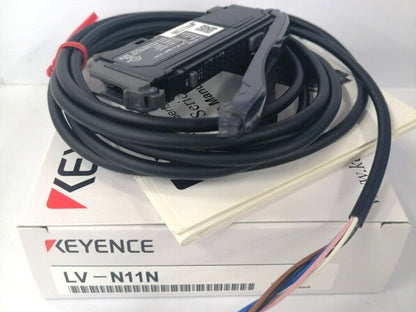 Keyence LV-N11N Laser Sensor with black cable, on box. Industrial automation sensor.