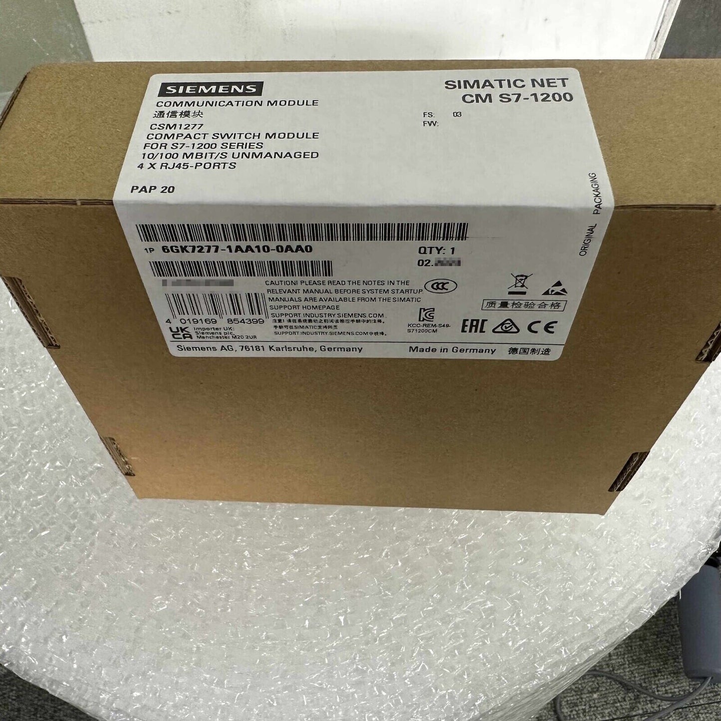 Siemens SIMATIC NET CM S7-1200 CSM1277 Compact Switch Module packaging, 6GK7277-1AA10-0AA0, PROFINET and Ethernet cabling.