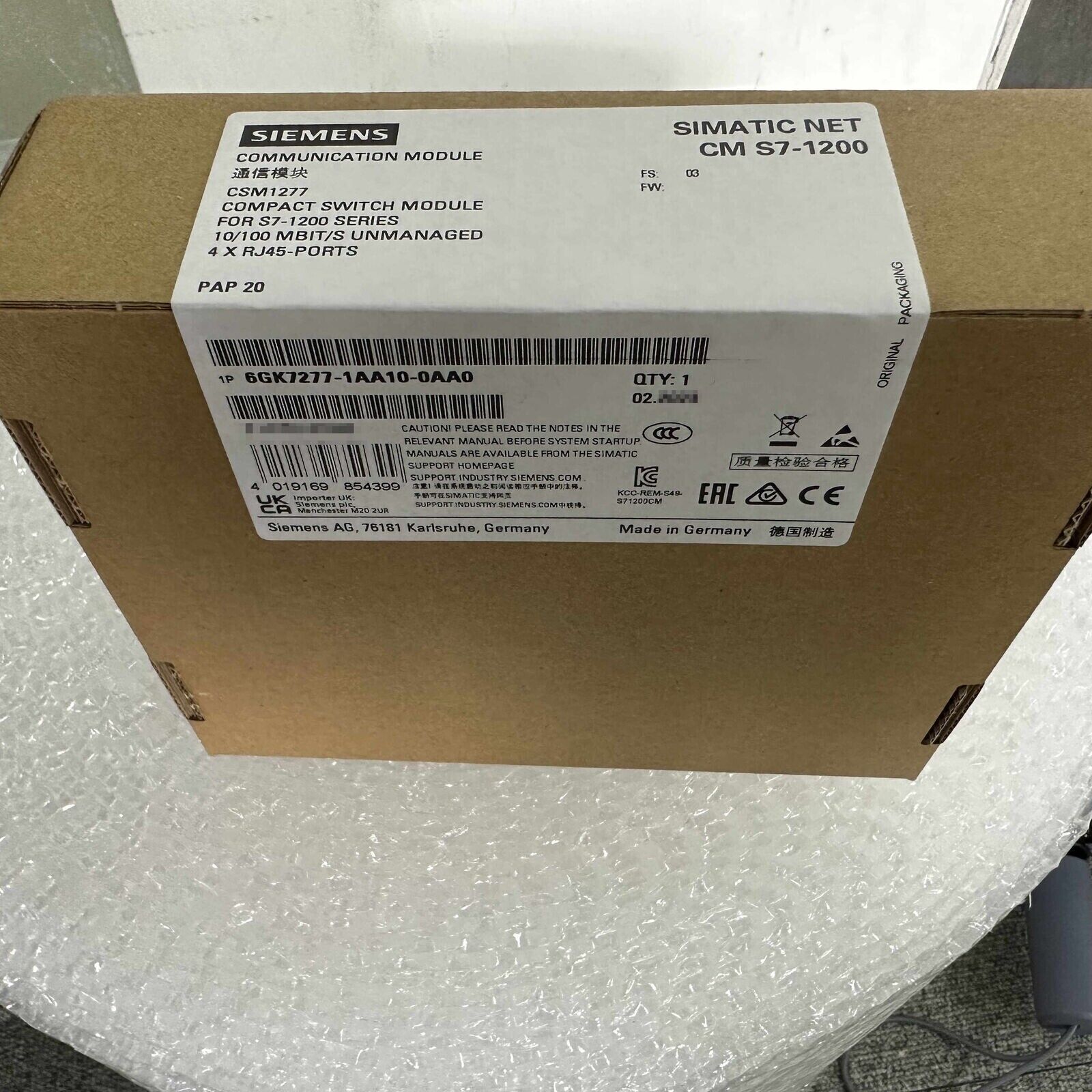 Siemens SIMATIC NET CM S7-1200 CSM1277 Compact Switch Module packaging, 6GK7277-1AA10-0AA0, PROFINET and Ethernet cabling.