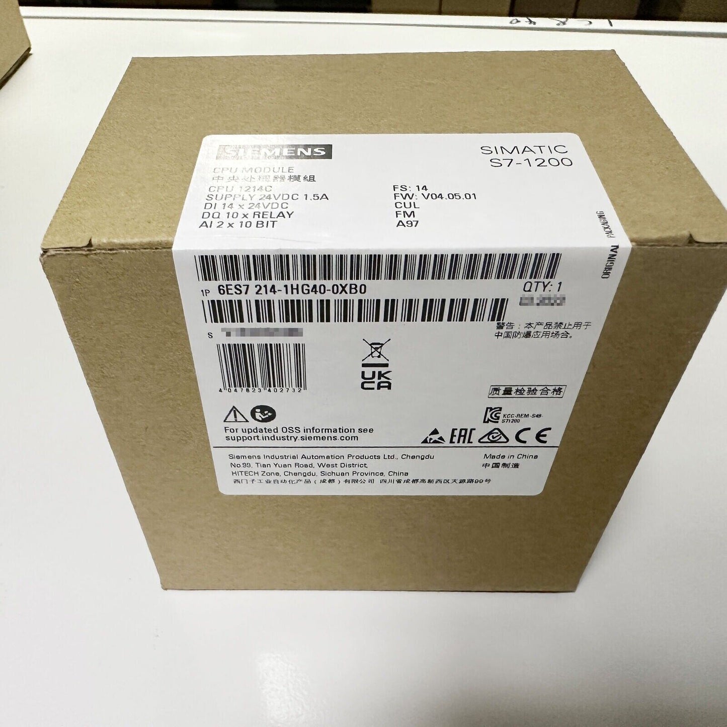 Siemens SIMATIC S7-1200 CPU 1214C, 6ES7214-1HG40-0XB0 PLC module packaging, industrial automation part.