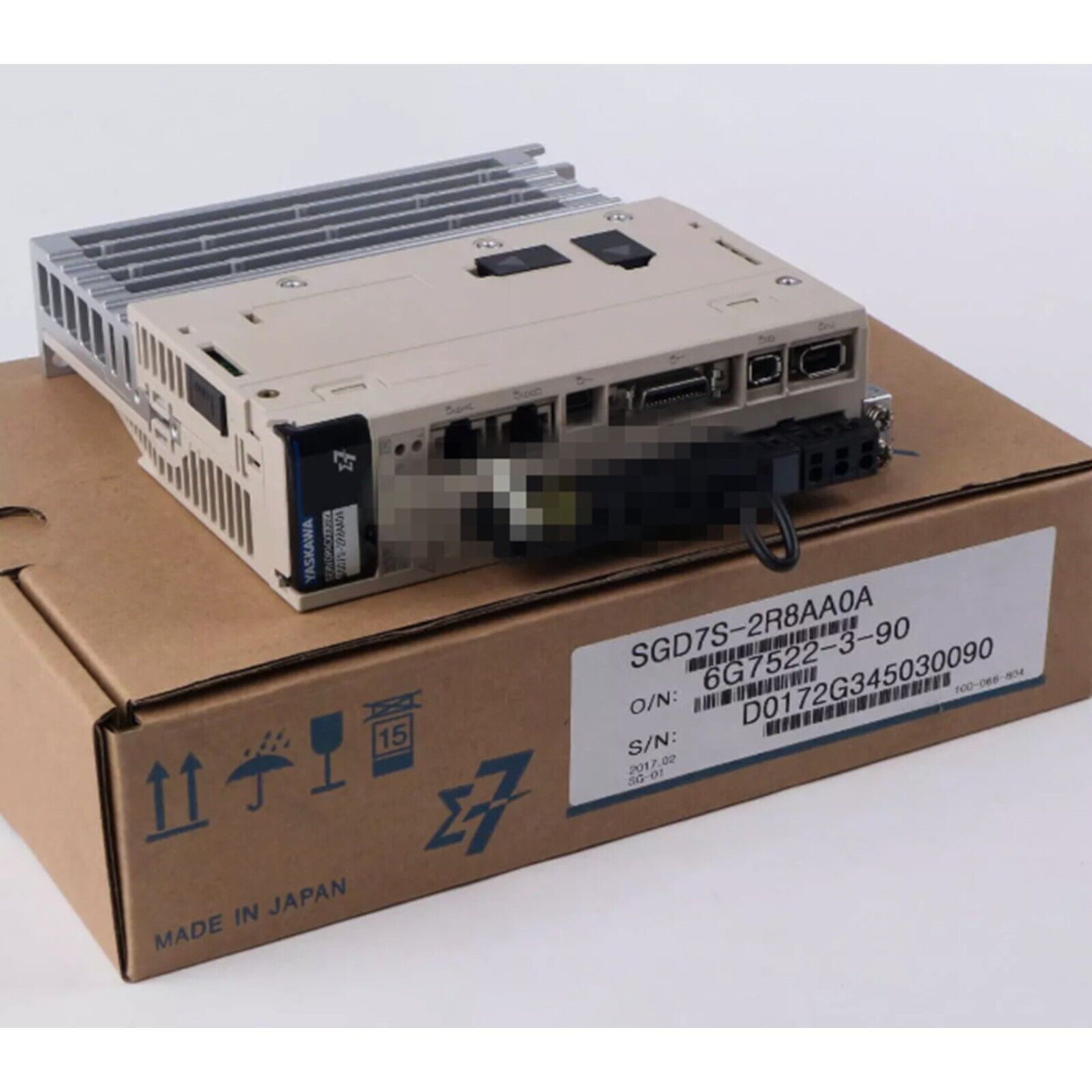 Yaskawa SGD7S-2R8AA0A servo drive on box, industrial automation part, Made in Japan, new condition.