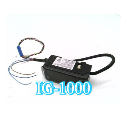 Keyence IG-1000 CCD Transmission Digital Laser Sensor.  Black sensor with wiring and IG-1000 text, new condition.