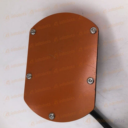 ABB IRB2400 robot body component. Orange metal plate with mounting screws and cables, industrial automation part.