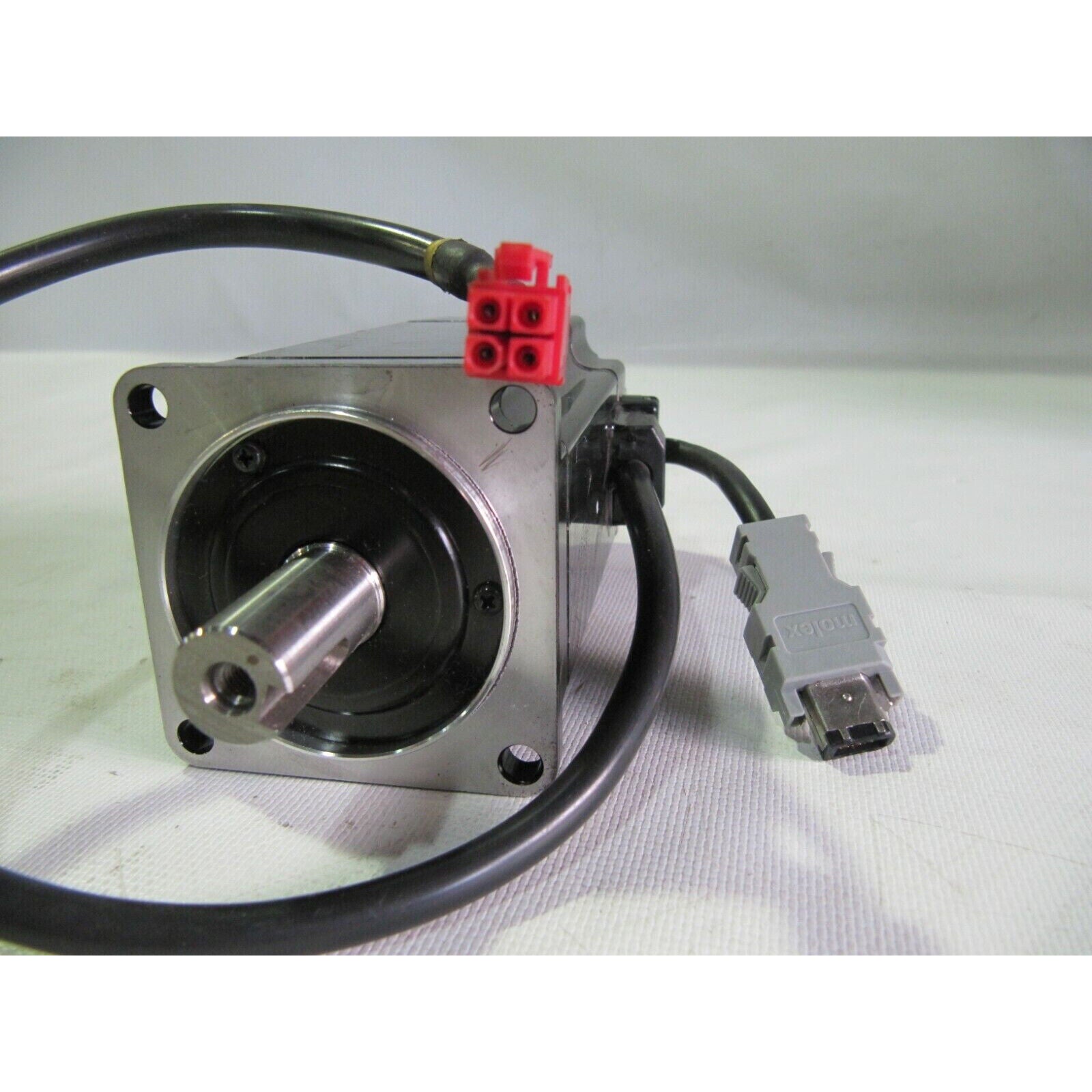 Yaskawa SGMAH-04A1F-AP41 AC Servo Motor, 200V 3000RPM, black with connectors and cables.
