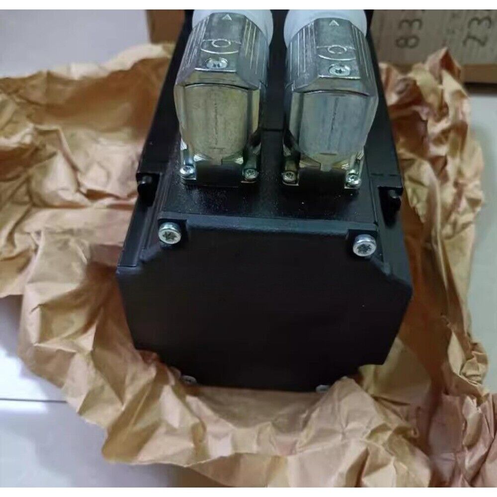 B&R 8LSA44.R2030D000-3 servo motor, black housing, silver connectors, industrial automation part on brown paper.