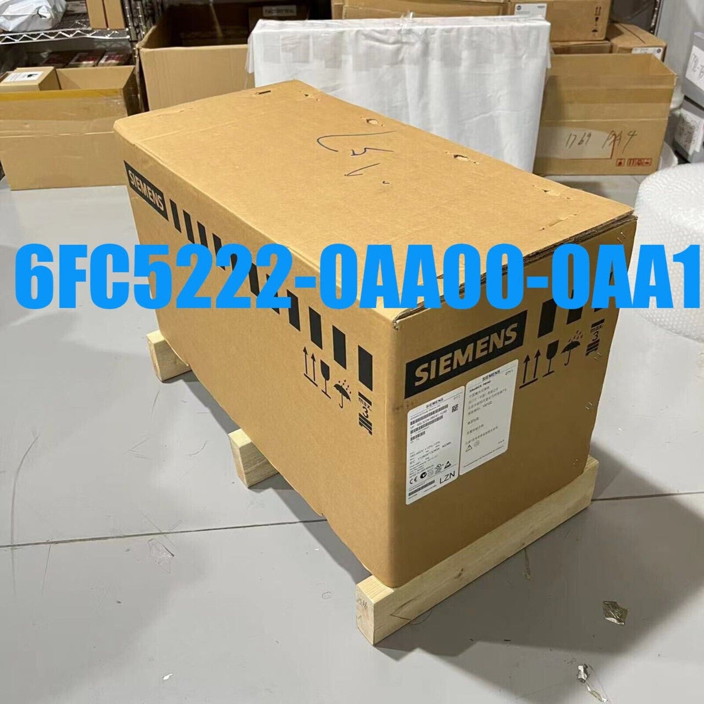 Siemens 6FC5222-0AA00-0AA1 SINUMERIK 840DI PLC module box on wooden pallet, industrial automation part.