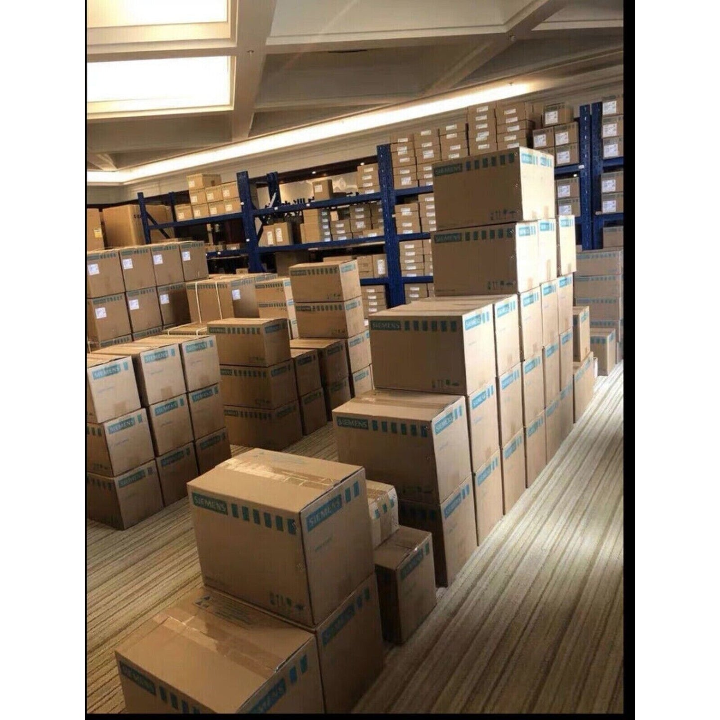 Warehouse stock of Siemens industrial automation parts in boxes, PLC modules, etc.