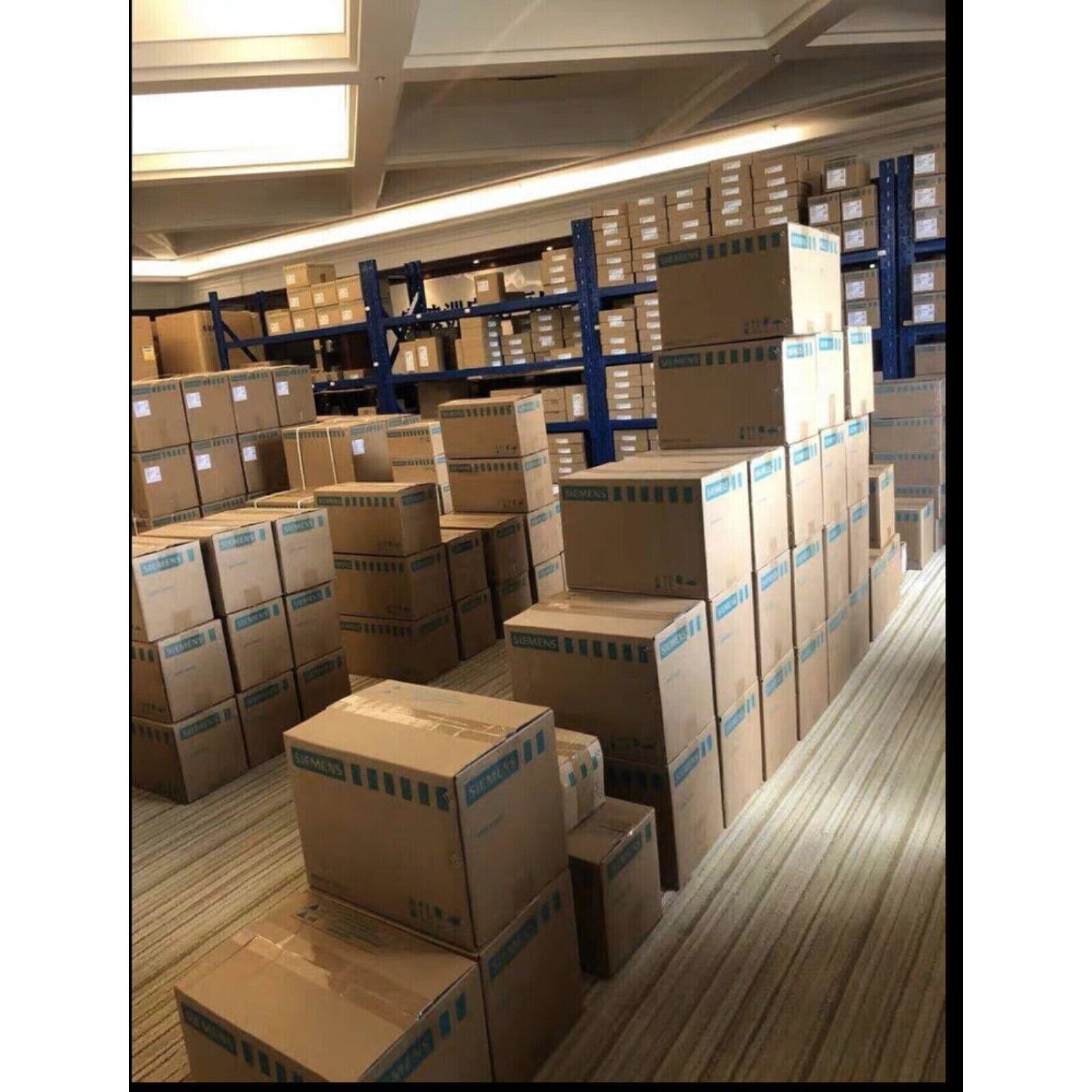 Warehouse stock of Siemens industrial automation parts in boxes, PLC modules, etc.