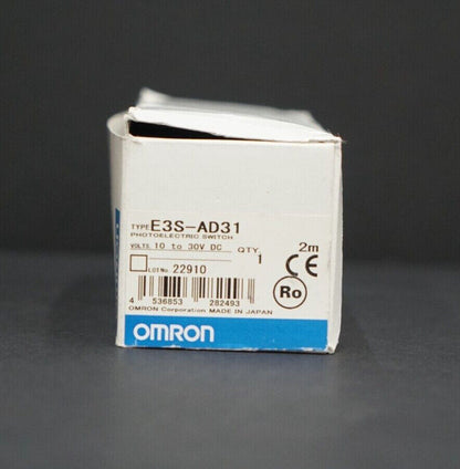 Omron E3S-AD31 photoelectric sensor box, labeled with product details, including voltage, quantity, and certification logos. 