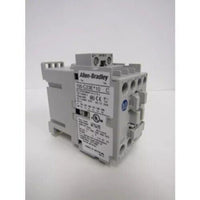 Allen-Bradley 100-C Series Contactor. Gray IEC contactor with product information labels. Electrical components.