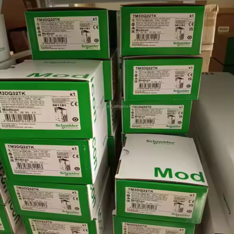 Schneider Electric TM3DQ32TK Modicon PLC modules in boxes, industrial automation components.