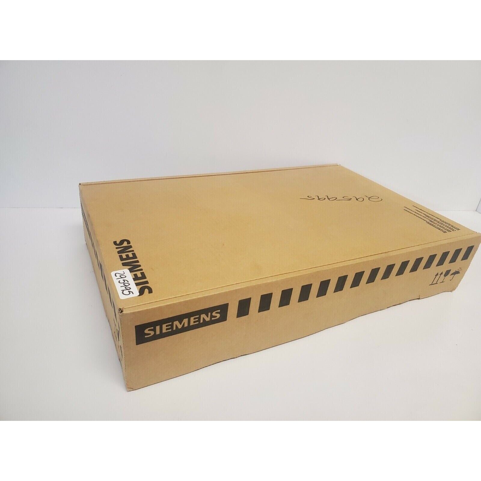 Siemens industrial automation part packaging box, cardboard with text and labels.