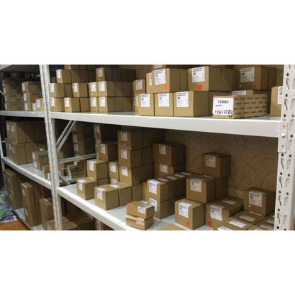 Siemens SINAMICS G120C control units stored on shelves. Industrial automation parts in warehouse.
