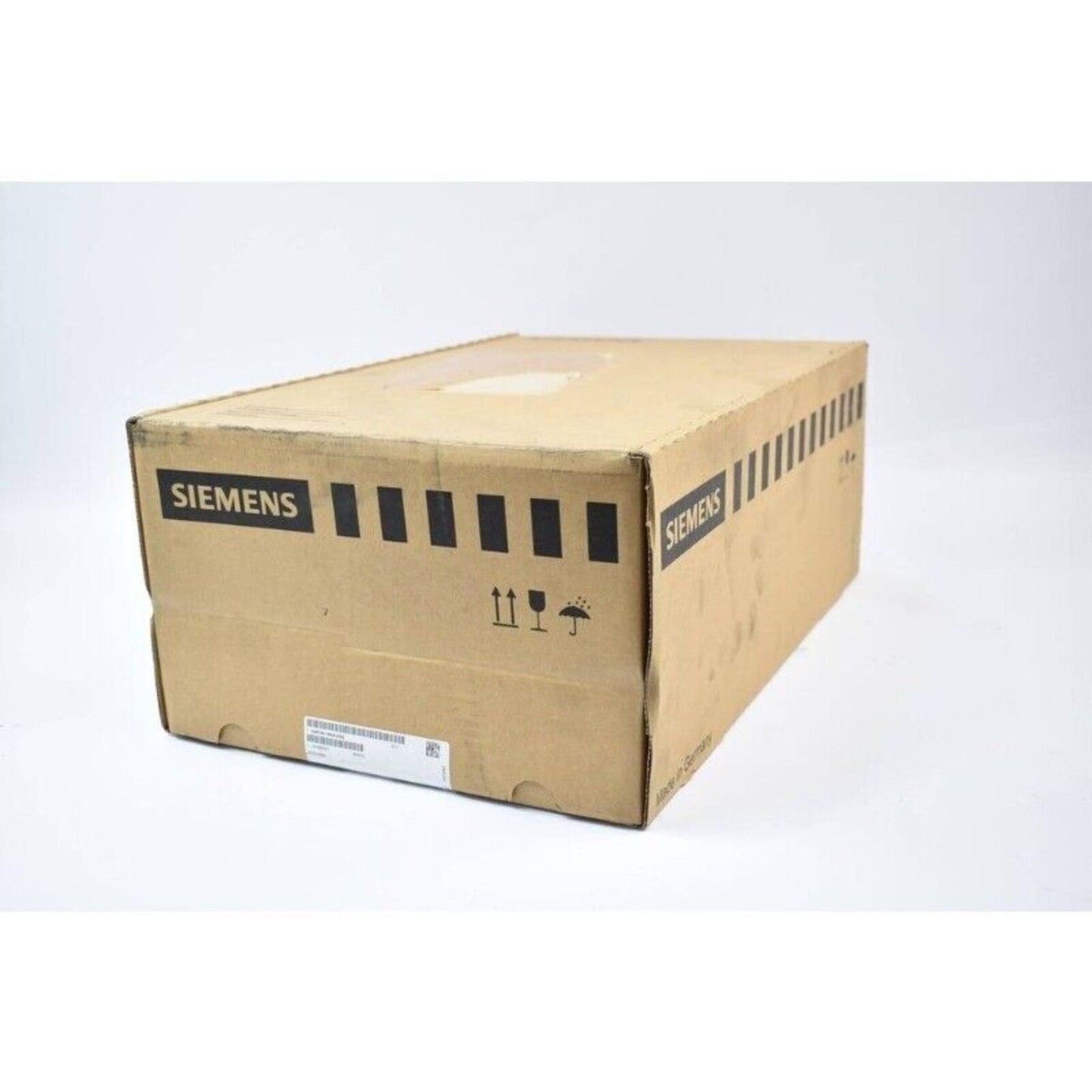Siemens industrial automation part in a brown cardboard box, Made in Germany, shipping symbols.