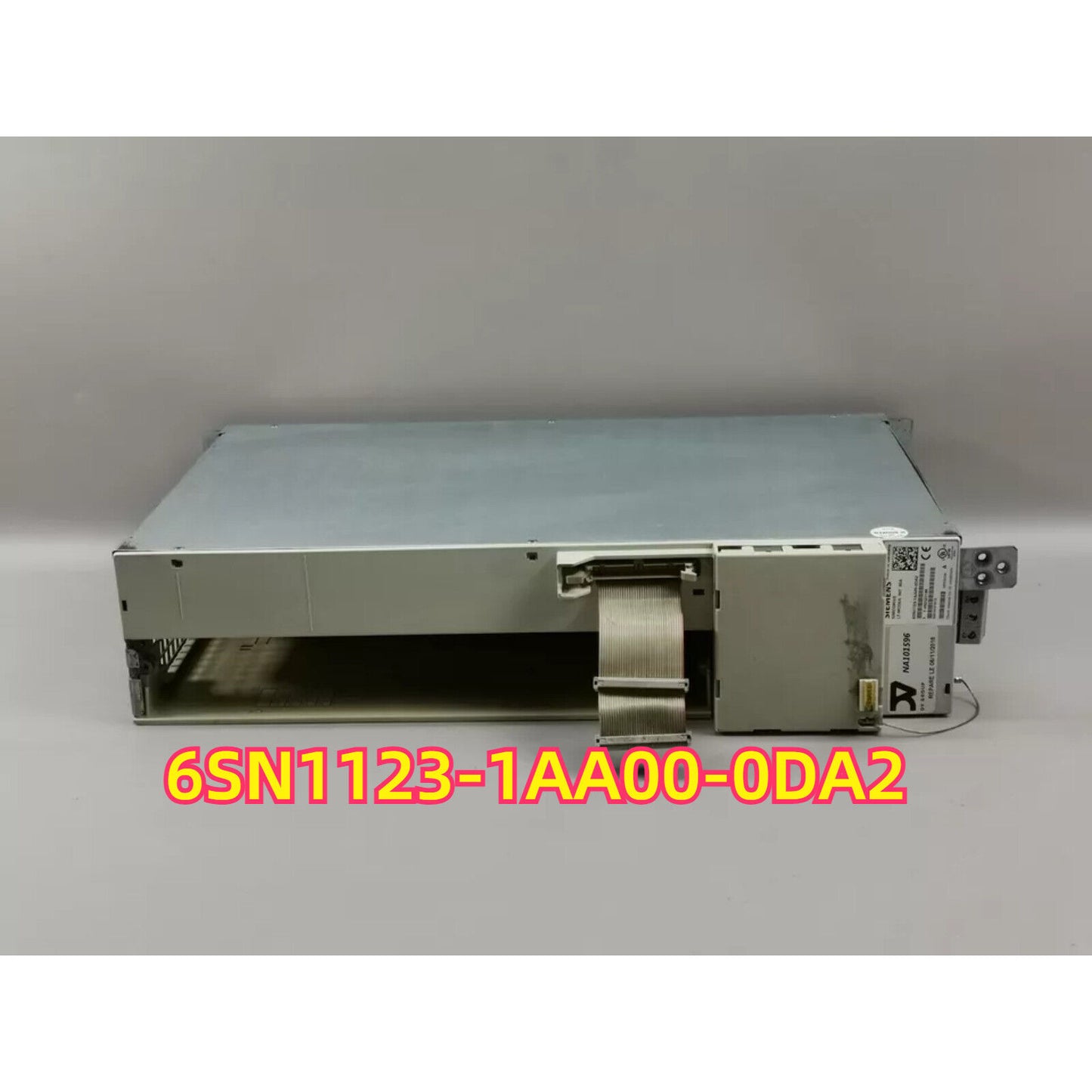 SIMODRIVE 611 6SN1123-1AA00-0DA2 power module. Industrial automation part, metal casing, cable and connector.