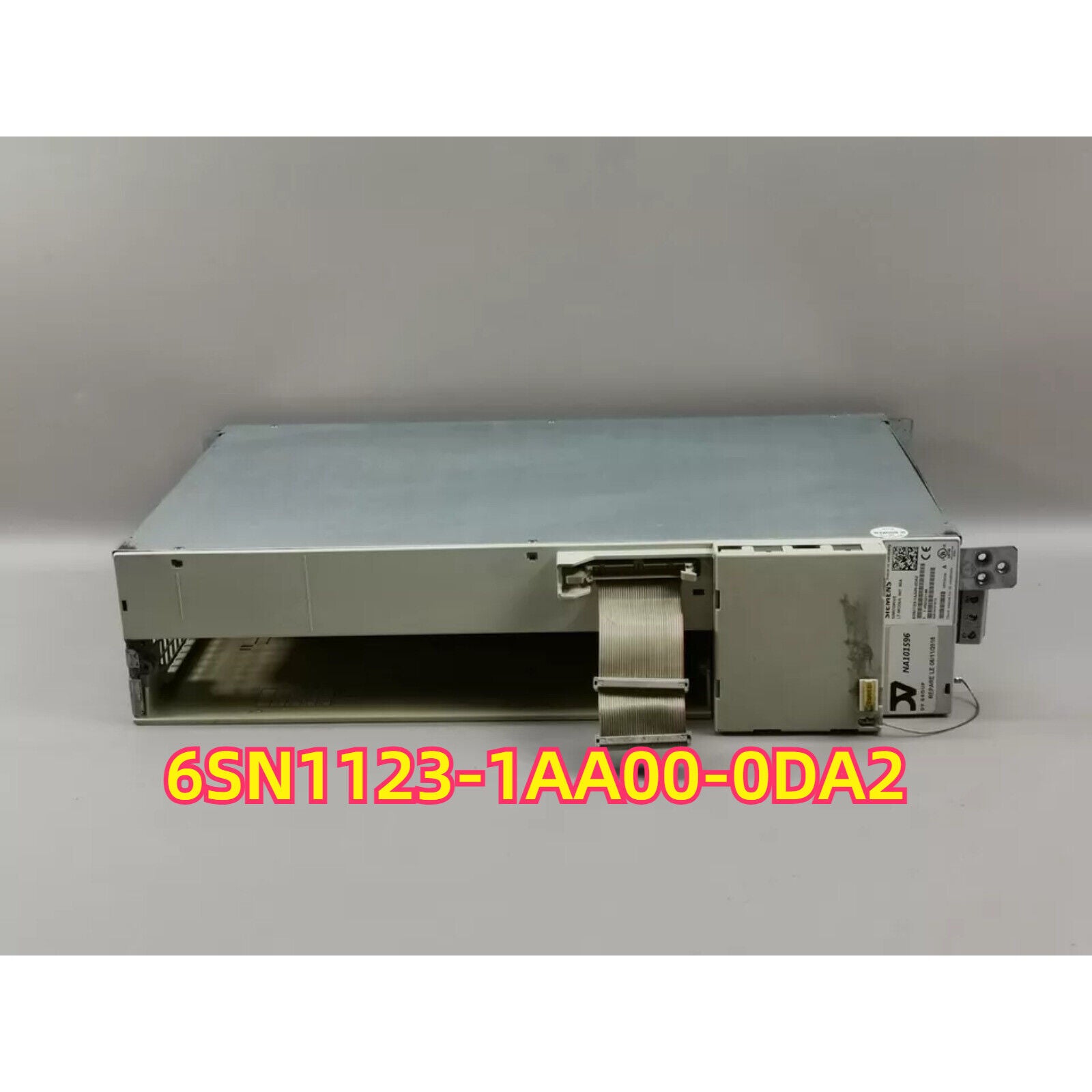 SIMODRIVE 611 6SN1123-1AA00-0DA2 power module. Industrial automation part, metal casing, cable and connector.