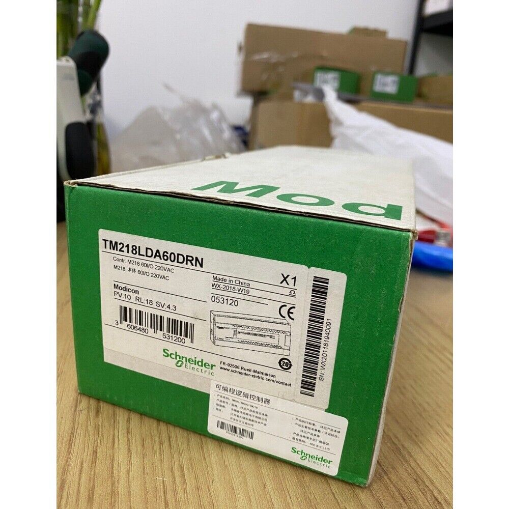 Schneider Electric Modicon TM218LDA60DRN Programmable Logic Controller module in green box, industrial automation part.
