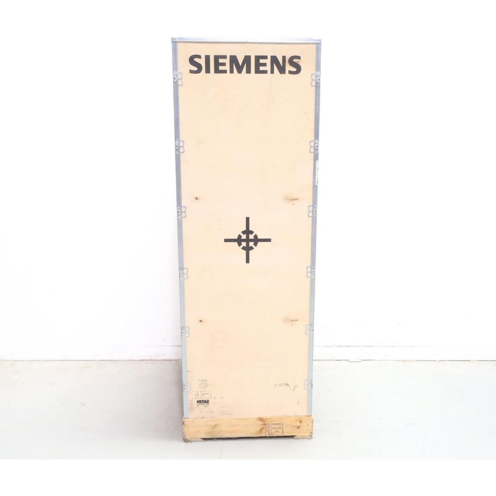 Siemens PLC module in shipping crate. Industrial automation parts.
