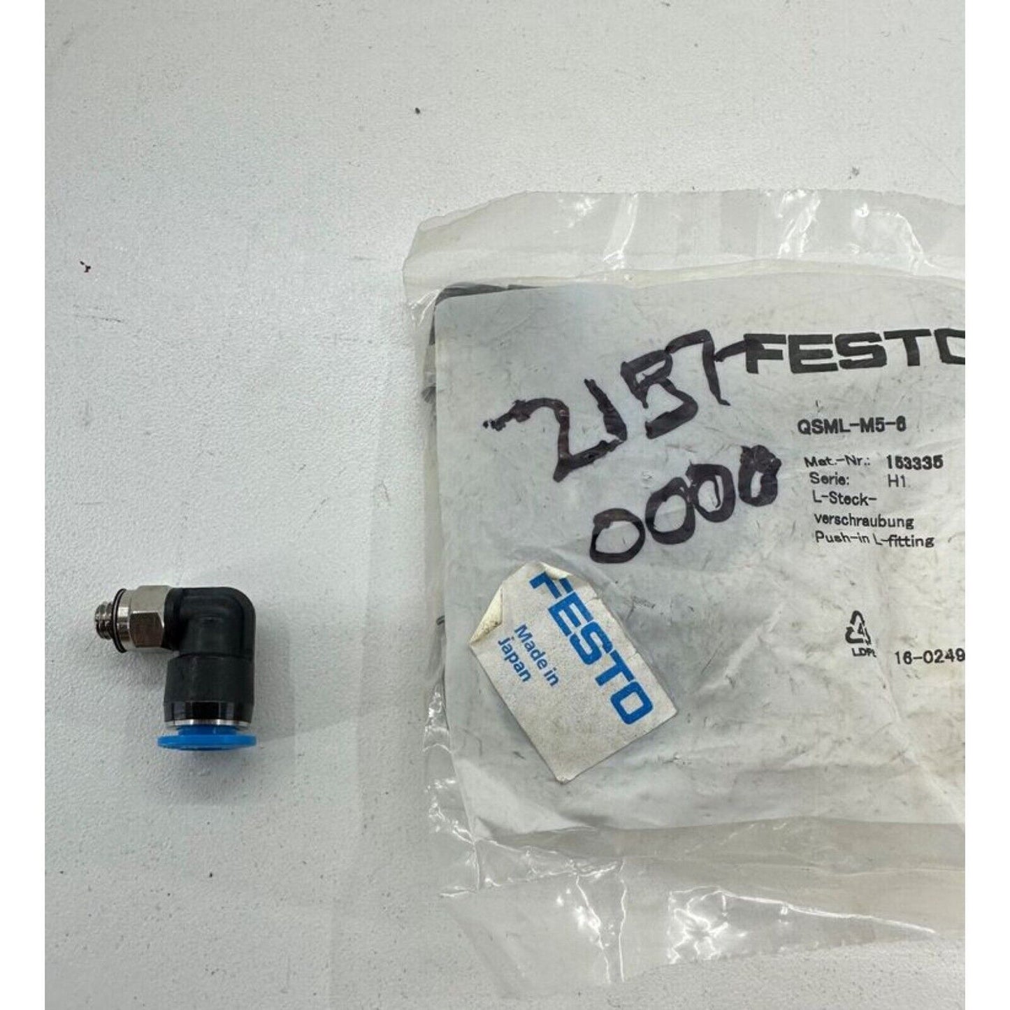 Festo QSML-M5-6 L-fitting pneumatic component, Made in Japan, with blue accents, black body and silver connector.