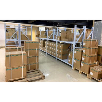 Warehouse stocked with Siemens industrial automation parts, ready for shipment, boxes on shelving units.